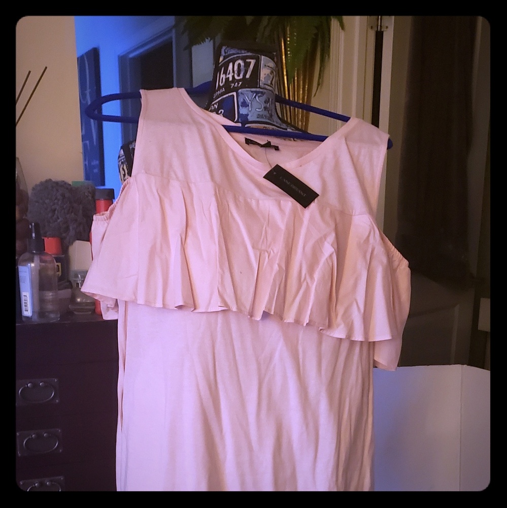 Pink shirt with cold shoulders.